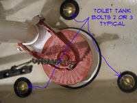 remove toilet tank bolts